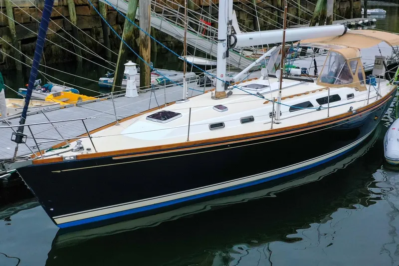 The Image of 2004 Sabre 426 sailboat docked at marina, featuring sleek design and classic lines. - 0