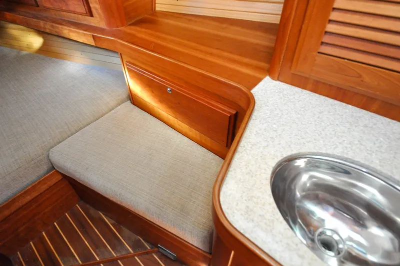 Slide: The Image of Interior of 2004 Sabre 426 yacht with wooden finish and compact sink. - 108