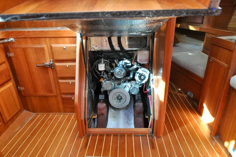 Slide: The Image of Engine compartment of a 2004 Sabre 426 yacht with wooden interior detailing. - 115