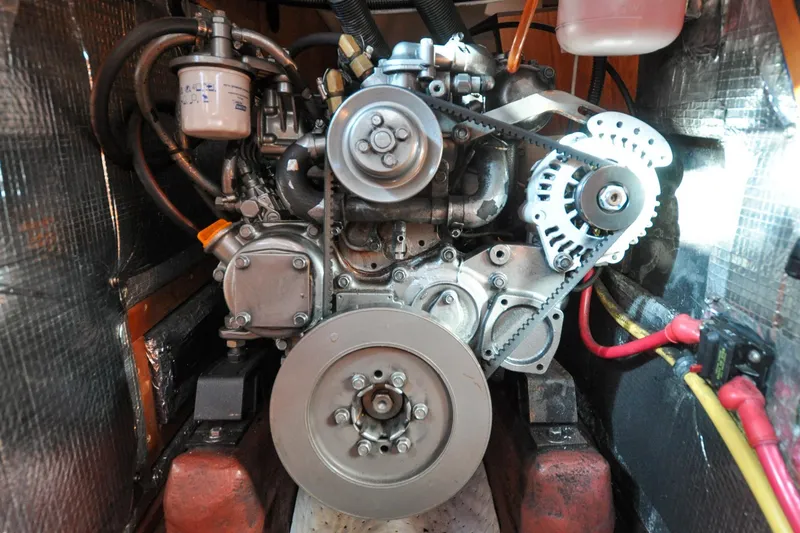 Slide: The Image of Engine of a 2004 Sabre 426 boat, showcasing belts and components. - 116