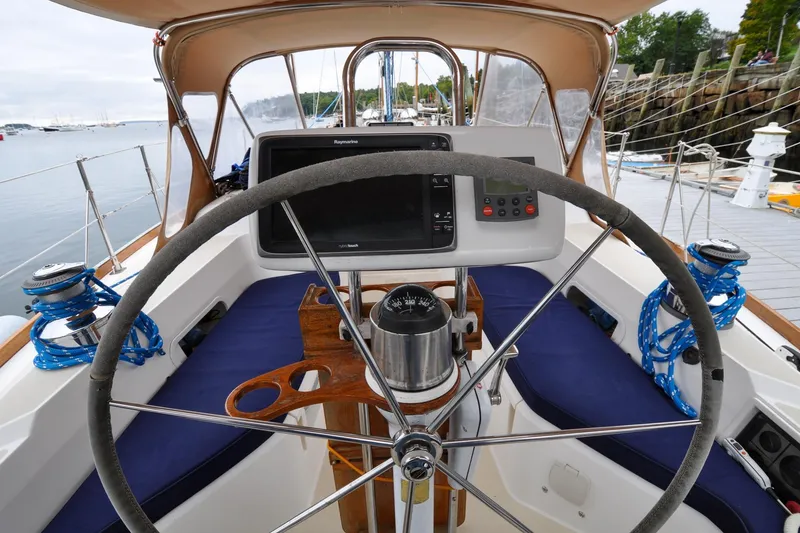 Slide: The Image of Cockpit view of 2004 Sabre 426 sailboat with navigation equipment and steering wheel. - 15