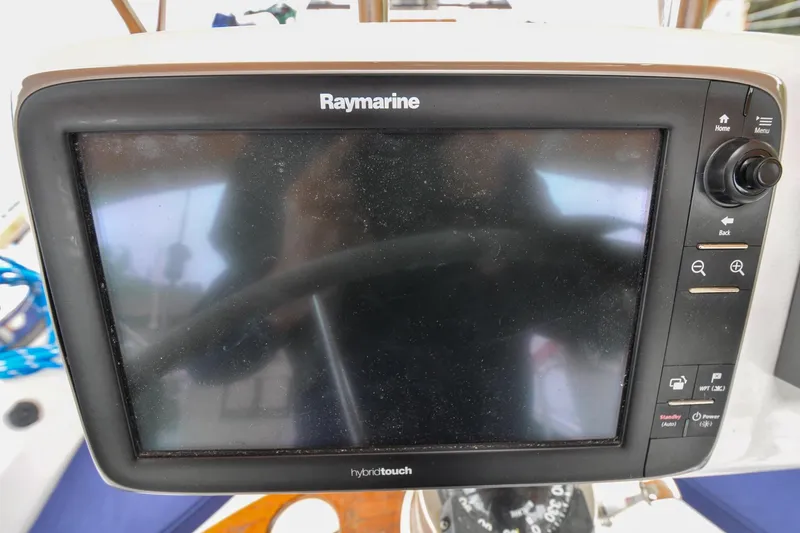 Slide: The Image of Raymarine HybridTouch display on 2004 Sabre 426 yacht, featuring navigation controls. - 17