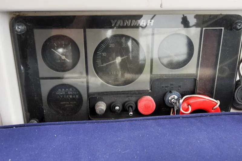 Slide: The Image of Control panel of a 2004 Sabre 426 with Yanmar engine gauges and switches. - 28