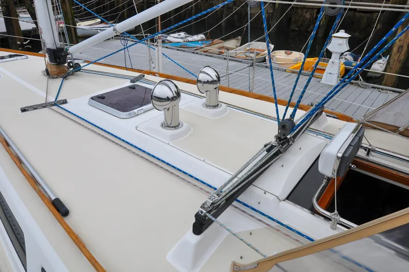 Slide: The Image of 2004 Sabre 426 sailboat deck with rigging and hatch, docked at marina. - 35