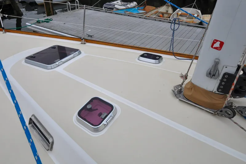Slide: The Image of Deck of 2004 Sabre 426 sailboat with hatches and mast details. - 37