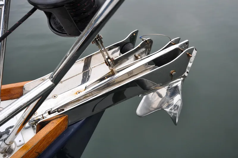 Slide: The Image of Bow anchor of 2004 Sabre 426 yacht, featuring polished metal and wooden accents. - 41