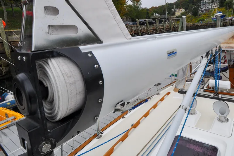 Slide: The Image of Close-up of a 2004 Sabre 426 sailboat mast with rolled sail and rigging. - 43