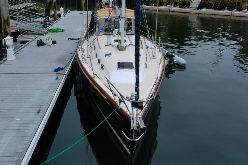 Slide: The Image of 2004 Sabre 426 sailboat docked at marina, viewed from the bow. - 6