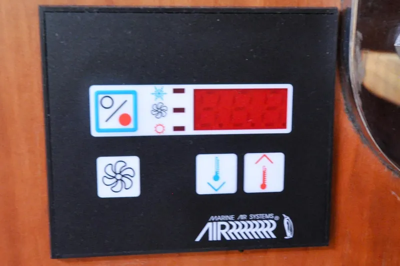 Slide: The Image of Control panel of a 2004 Sabre 426 Marine Air Systems, featuring temperature and fan settings. - 62