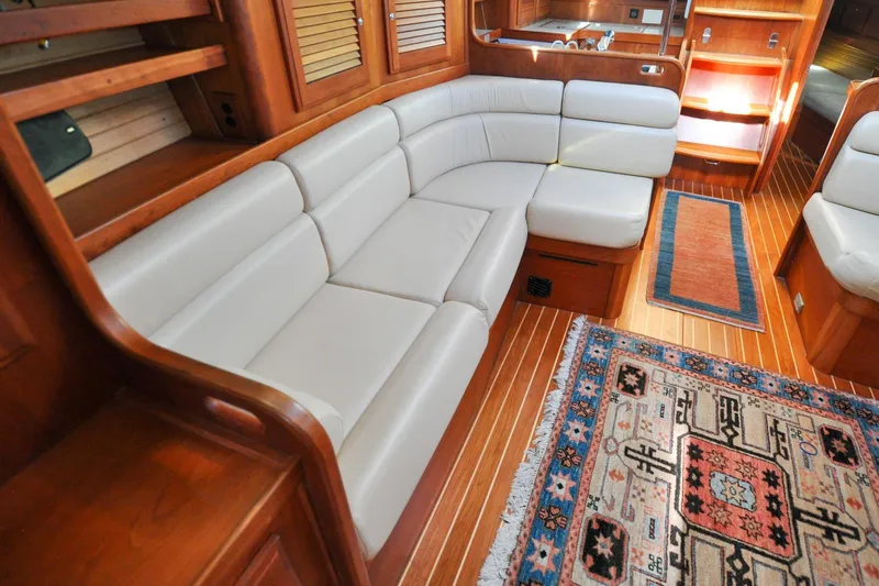 Slide: The Image of Luxurious 2004 Sabre 426 yacht interior with elegant wood finish and plush seating. - 66