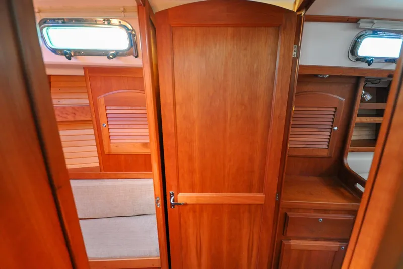 Slide: The Image of Interior of 2004 Sabre 426 yacht with wooden cabinetry and seating area. - 71