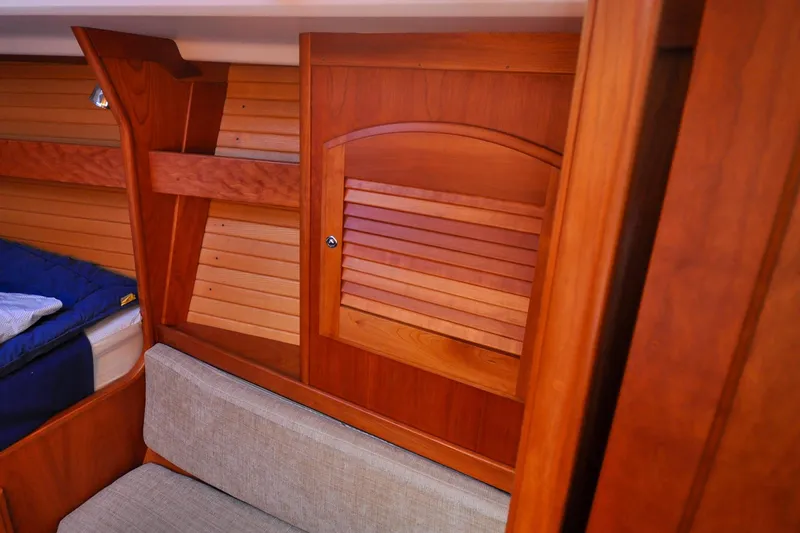 Slide: The Image of Interior of 2004 Sabre 426 yacht with wooden paneling and seating area. - 73