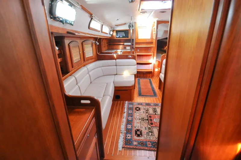 Slide: The Image of Luxurious interior of 2004 Sabre 426 yacht with elegant wood finish and cozy seating. - 87