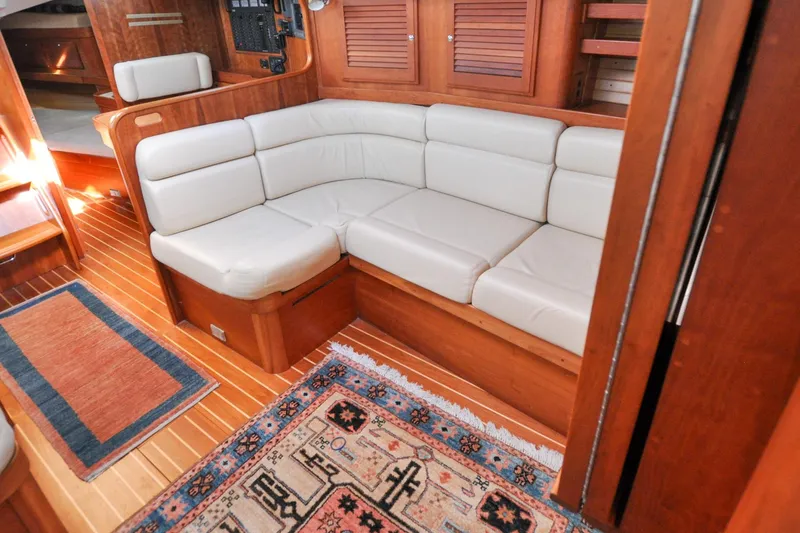 Slide: The Image of Luxurious 2004 Sabre 426 yacht interior with plush seating and elegant wood finish. - 88