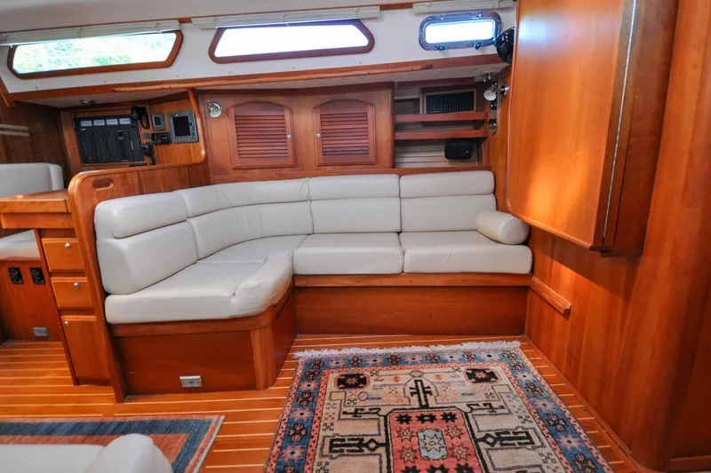 Slide: The Image of Luxurious 2004 Sabre 426 yacht interior with plush seating and elegant wood finish. - 89