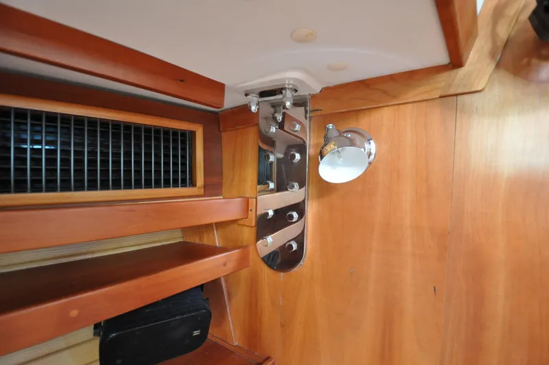 Slide: The Image of Interior of 2004 Sabre 426 yacht with wooden paneling and metal fixtures. - 91