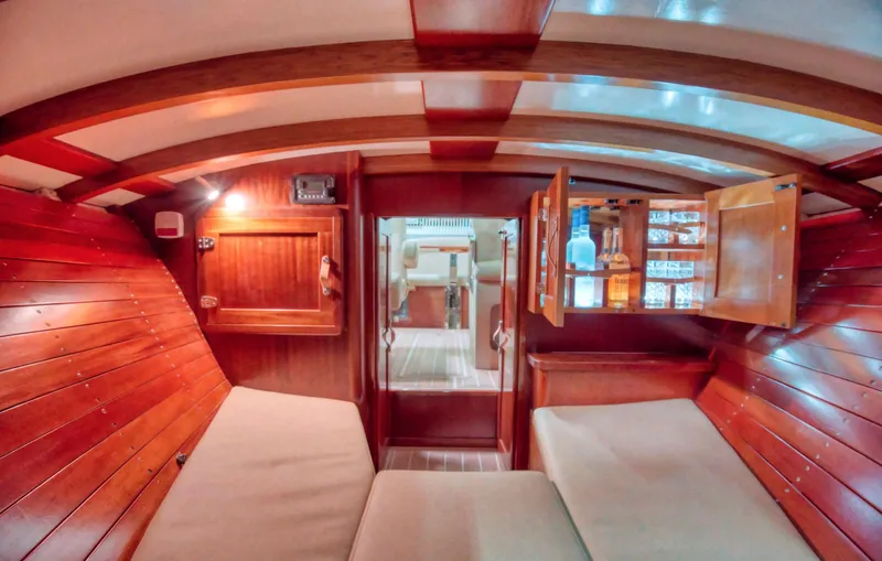 Slide: The Image of Interior of 2020 Custom Windlea Runabout with wooden paneling and cozy seating. - 14