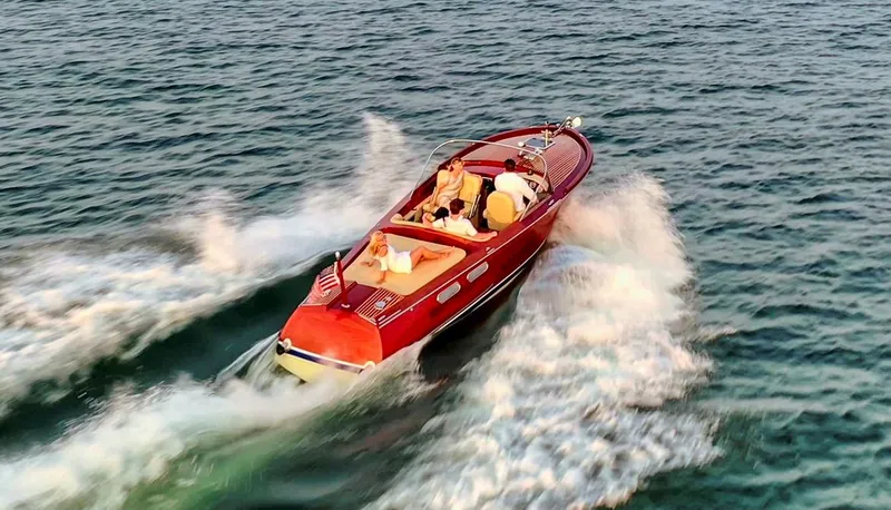 Slide: The Image of Custom 2020 Windlea Runabout boat cruising on open water with passengers. - 2