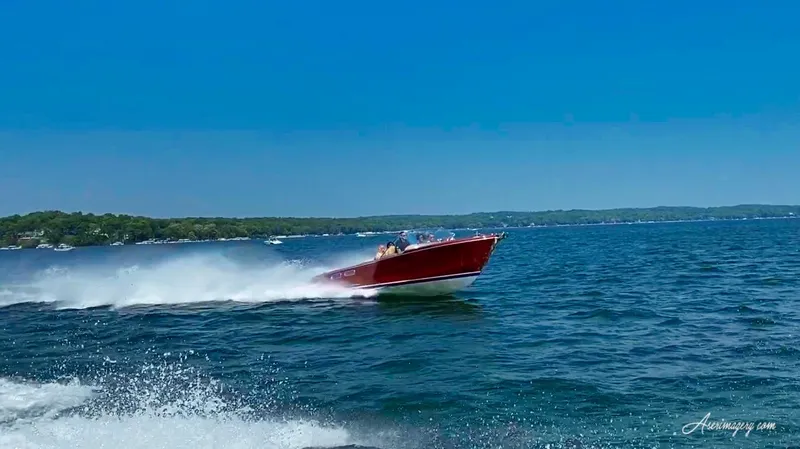 Slide: The Image of Custom 2020 Windlea Runabout speeding on a clear blue lake under a sunny sky. - 35