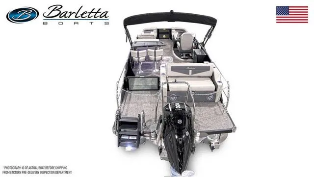 Slide: The Image of 2025 Barletta Boats C24UE pontoon with sleek design and modern features, displayed with American flag. - 6