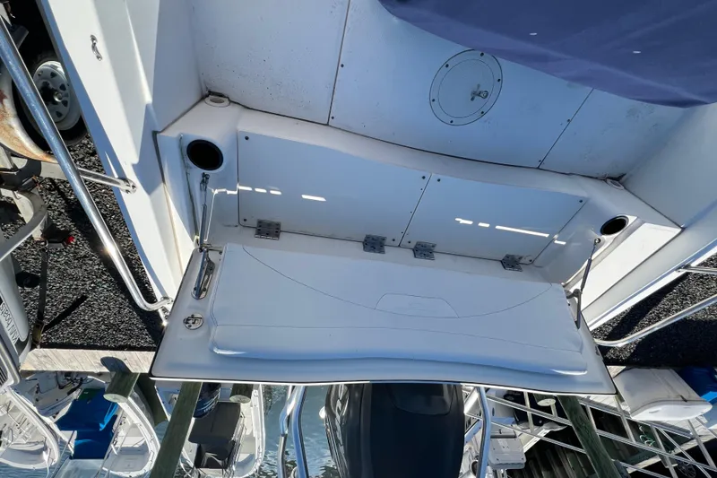 Slide: The Image of 2009 Boston Whaler 180 Dauntless boat deck with storage compartment and railing. - 10