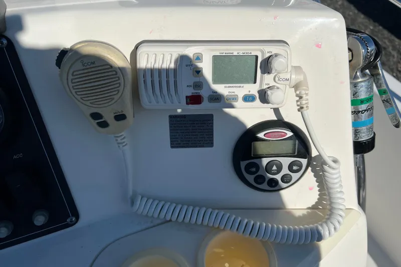 Slide: The Image of Control panel of a 2009 Boston Whaler 180 Dauntless with Icom marine radio. - 15