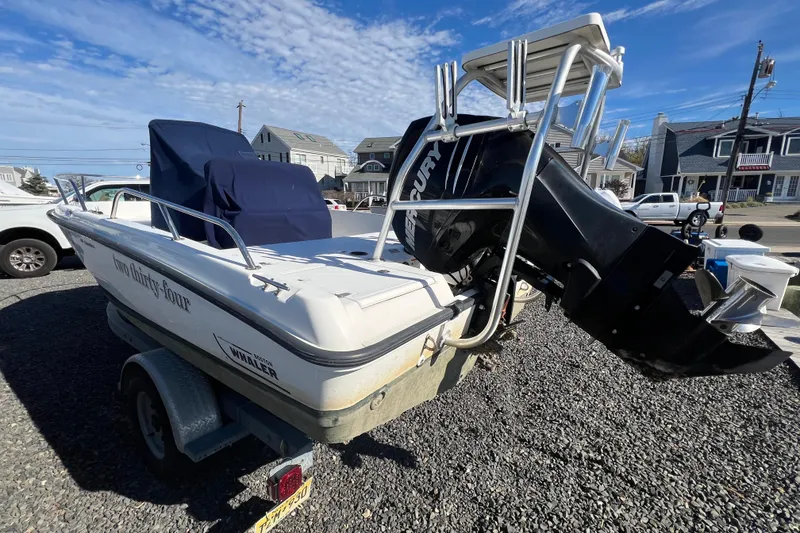 Slide: The Image of 2009 Boston Whaler 180 Dauntless boat with Mercury engine on a trailer. - 6