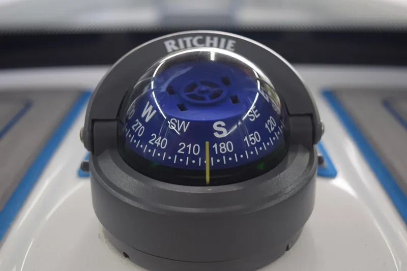Slide: The Image of Ritchie compass on 2022 Aquasport 2300 Center Console boat dashboard. - 24