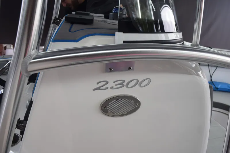 Slide: The Image of 2022 Aquasport 2300 Center Console boat dashboard with stainless steel rail. - 25