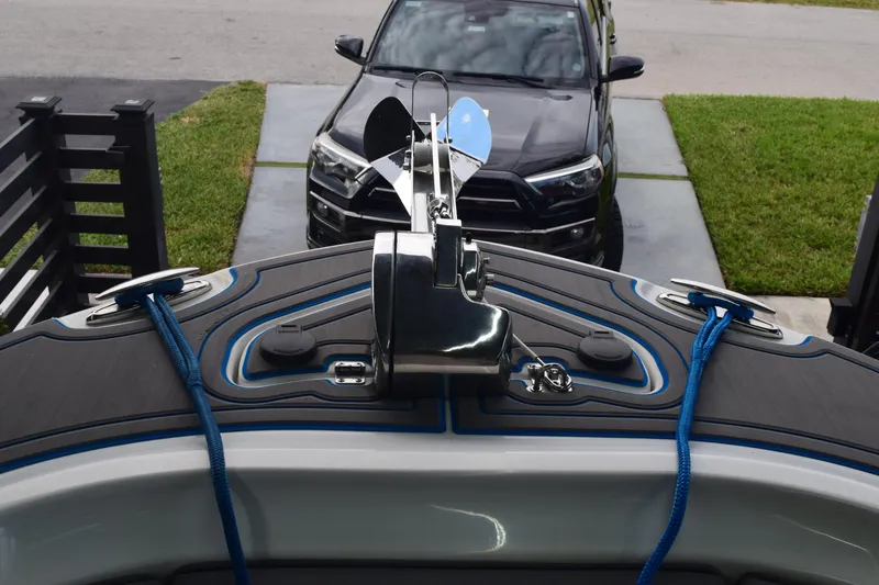 Slide: The Image of 2022 Aquasport 2300 Center Console boat bow with anchor and blue ropes. - 26