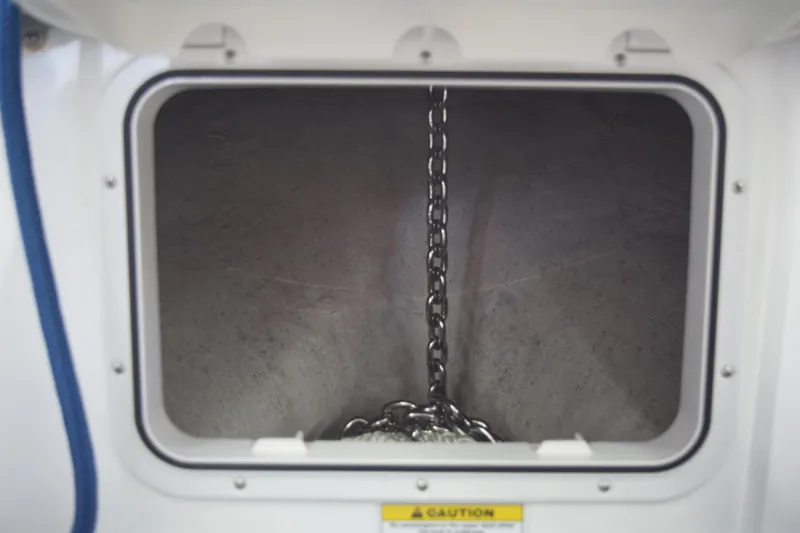 Slide: The Image of 2022 Aquasport 2300 Center Console anchor chain compartment. - 27
