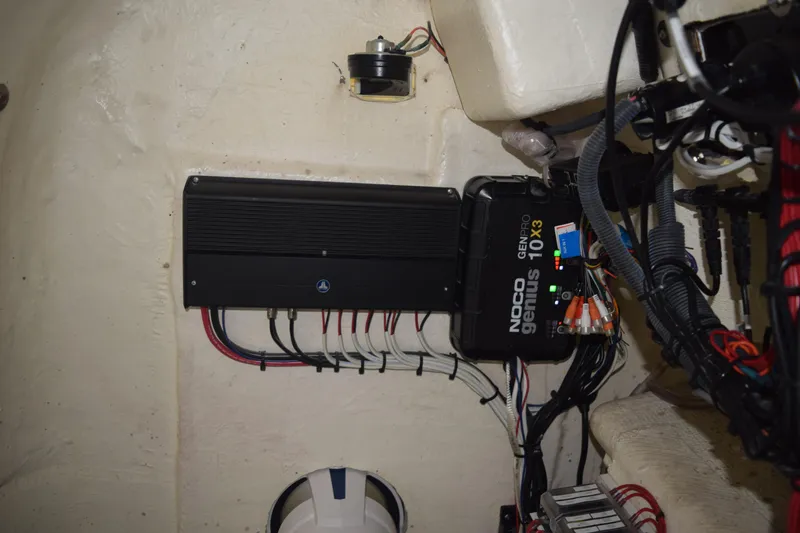 Slide: The Image of 2022 Aquasport 2300 Center Console electrical system with NOCO Genius charger. - 35