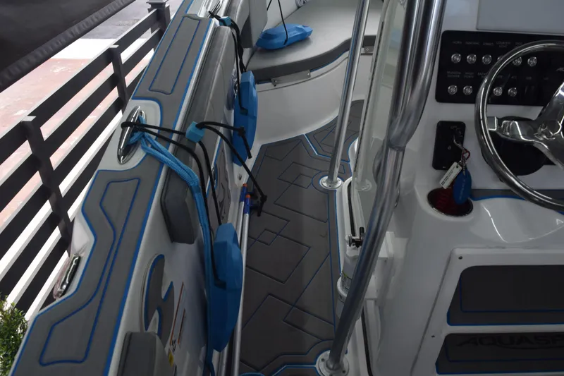 Slide: The Image of 2022 Aquasport 2300 Center Console interior with modern design and controls. - 39