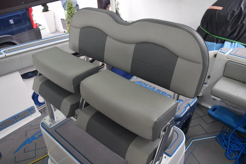 Slide: The Image of 2022 Aquasport 2300 Center Console boat seating with gray upholstery and modern design. - 41