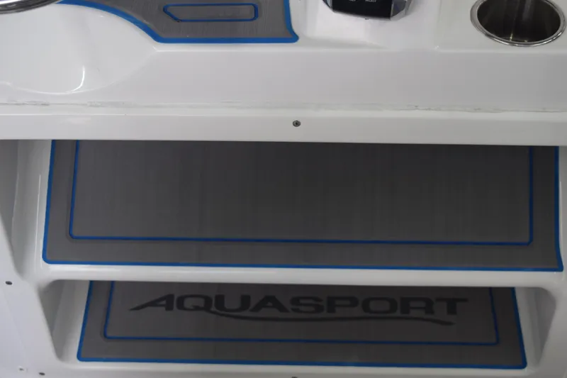 Slide: The Image of 2022 Aquasport 2300 Center Console interior with storage compartments. - 49
