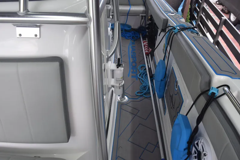 Slide: The Image of 2022 Aquasport 2300 Center Console interior with seating and storage features. - 60