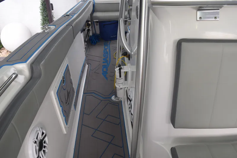Slide: The Image of 2022 Aquasport 2300 Center Console interior with sleek seating and modern design. - 63
