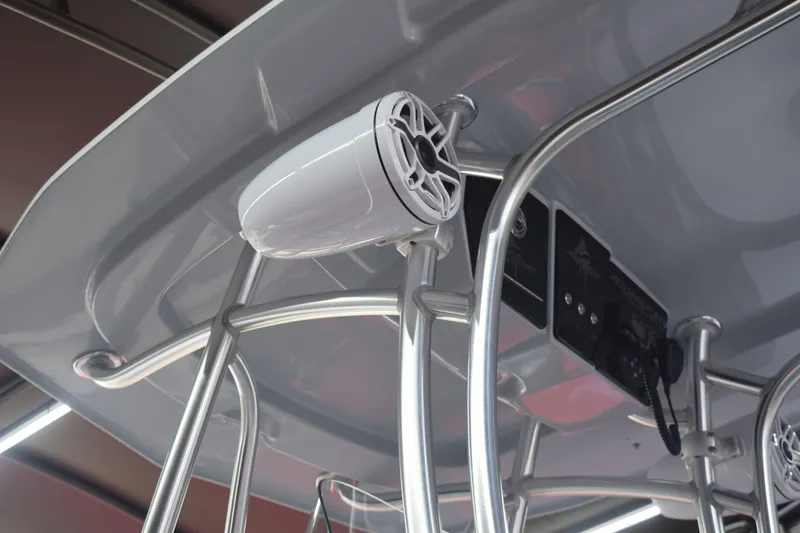 Slide: The Image of 2022 Aquasport 2300 Center Console boat with mounted speaker and control panel. - 73