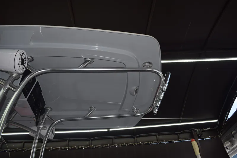 Slide: The Image of 2022 Aquasport 2300 Center Console boat with stainless steel T-top and mounted speakers. - 77