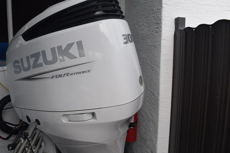 Slide: The Image of 2022 Aquasport 2300 Center Console with Suzuki 300HP four-stroke outboard engine. - 79