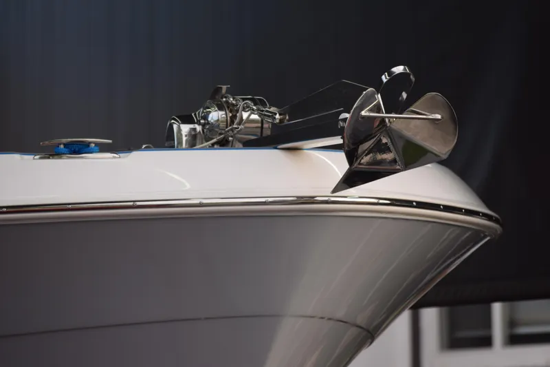 Slide: The Image of 2022 Aquasport 2300 Center Console boat anchor detail in a modern showroom. - 8
