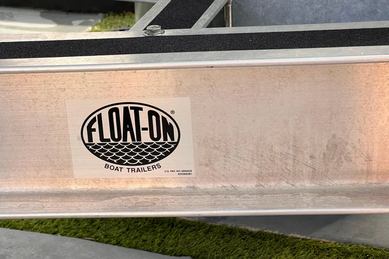 Slide: The Image of Float-On boat trailer for 2022 Aquasport 2300 Center Console. - 82