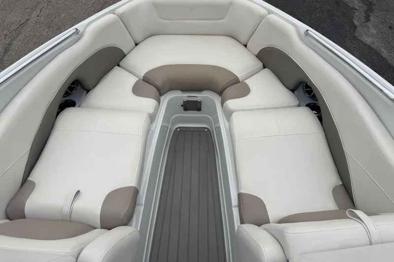Slide: The Image of Luxurious seating area of 2019 Crownline 275 SS boat with beige and white upholstery. - 13