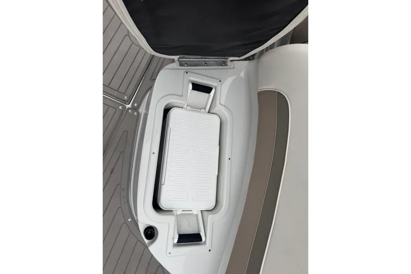 Slide: The Image of 2019 Crownline 275 SS boat storage compartment with integrated cooler. - 16
