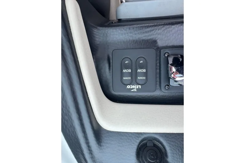 Slide: The Image of Control panel of a 2019 Crownline 275 SS boat with Lenco switches. - 18