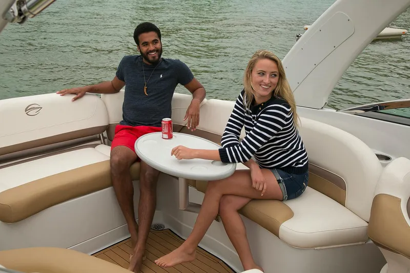 Slide: The Image of 2019 Crownline 275 SS boat interior with spacious seating and modern dashboard. - 7