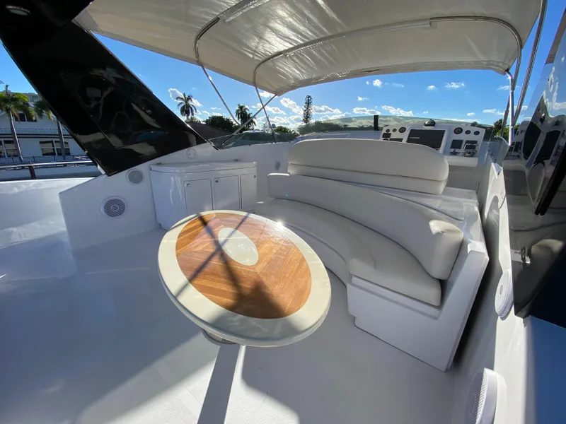 Slide: The Image of Luxurious 2007 Rodriquez 80 Widebody yacht deck with seating and table under canopy. - 12