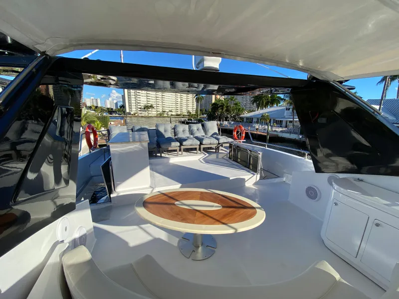 Slide: The Image of Luxurious 2007 Rodriquez 80 Widebody yacht deck with seating and scenic waterfront view. - 14