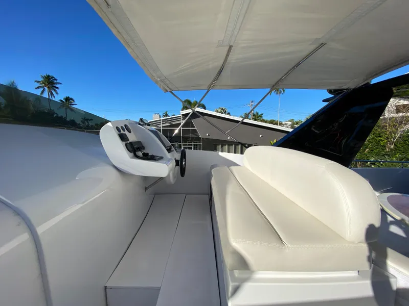 Slide: The Image of Luxury yacht deck with seating, Rodriquez 80 Widebody, 2007 model, under clear blue sky. - 16