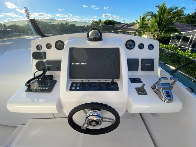 Slide: The Image of Helm of 2007 Rodriquez 80 Widebody yacht with navigation controls and steering wheel. - 17